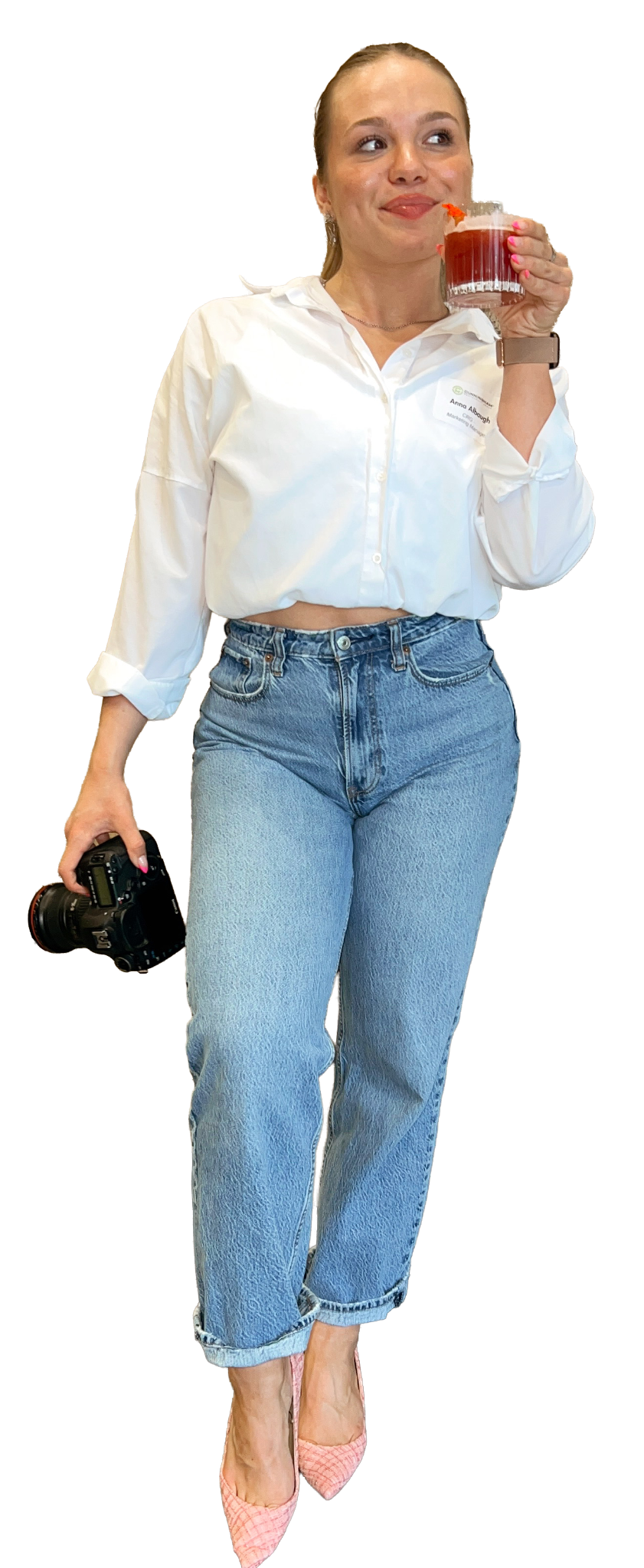 Anna Albaugh holding a camera and a drink