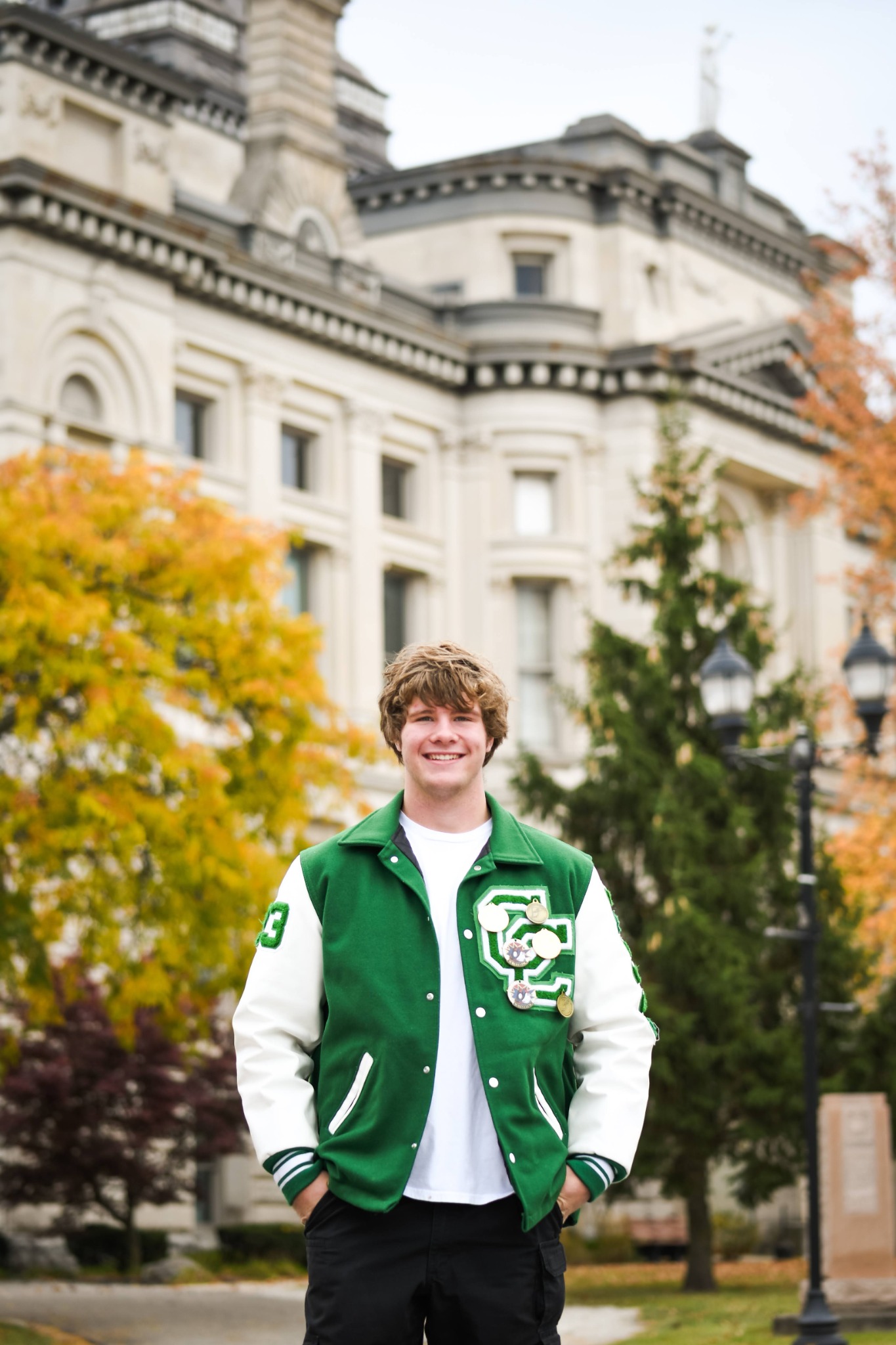 Senior student portrait in front of a campus building