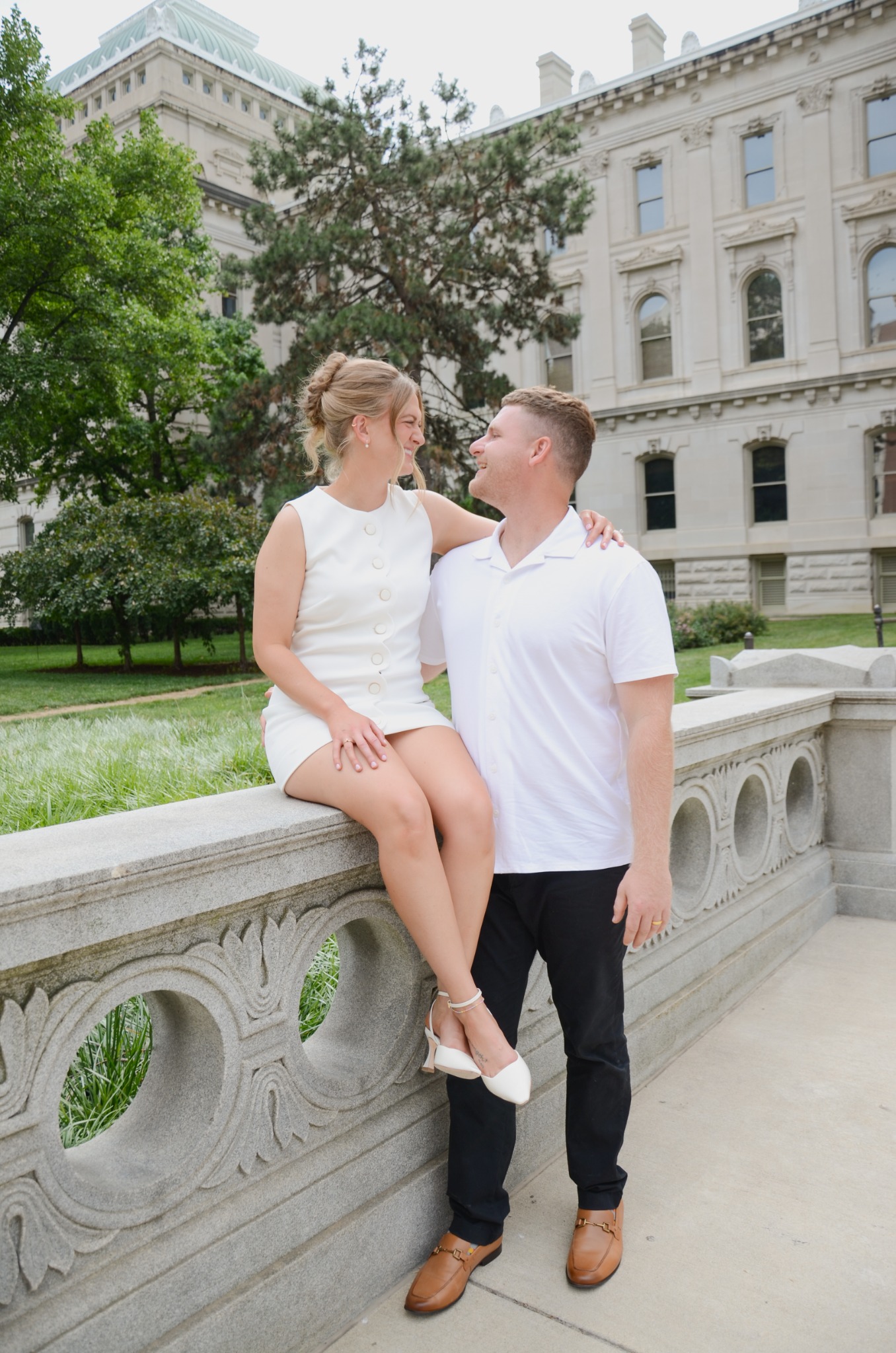 Wedding couple together outside a historic building