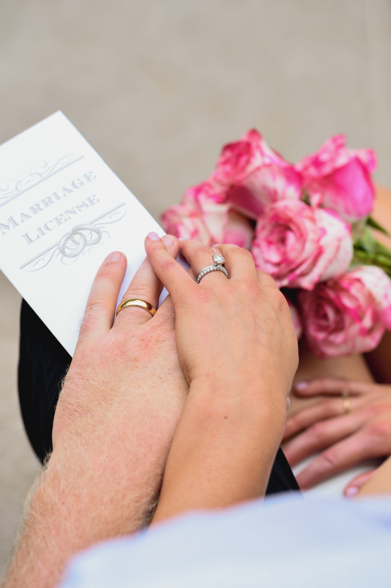 Wedding couple seated together on courthouse steps